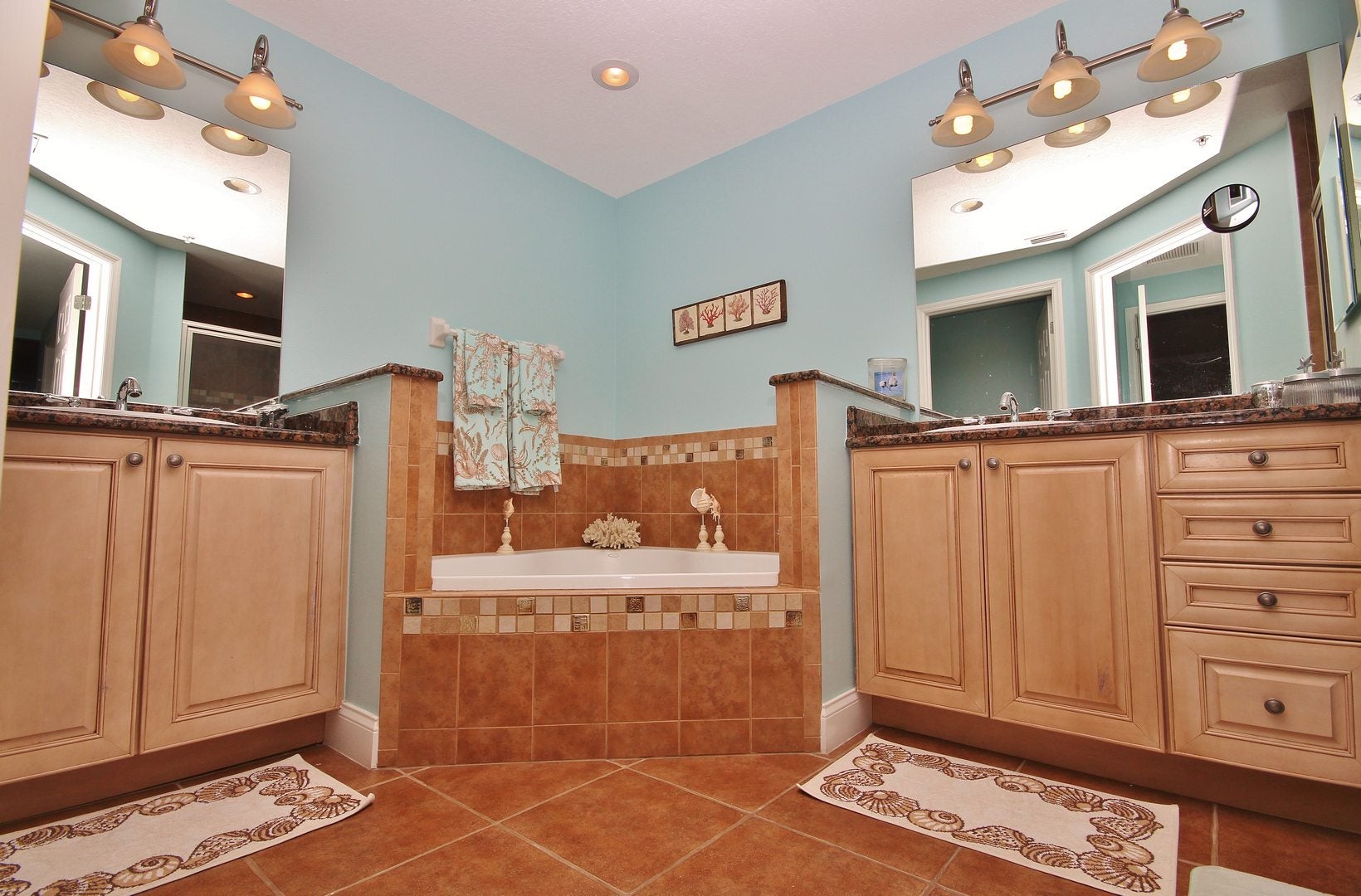 The Primary Bathroom with a tub and two sinks