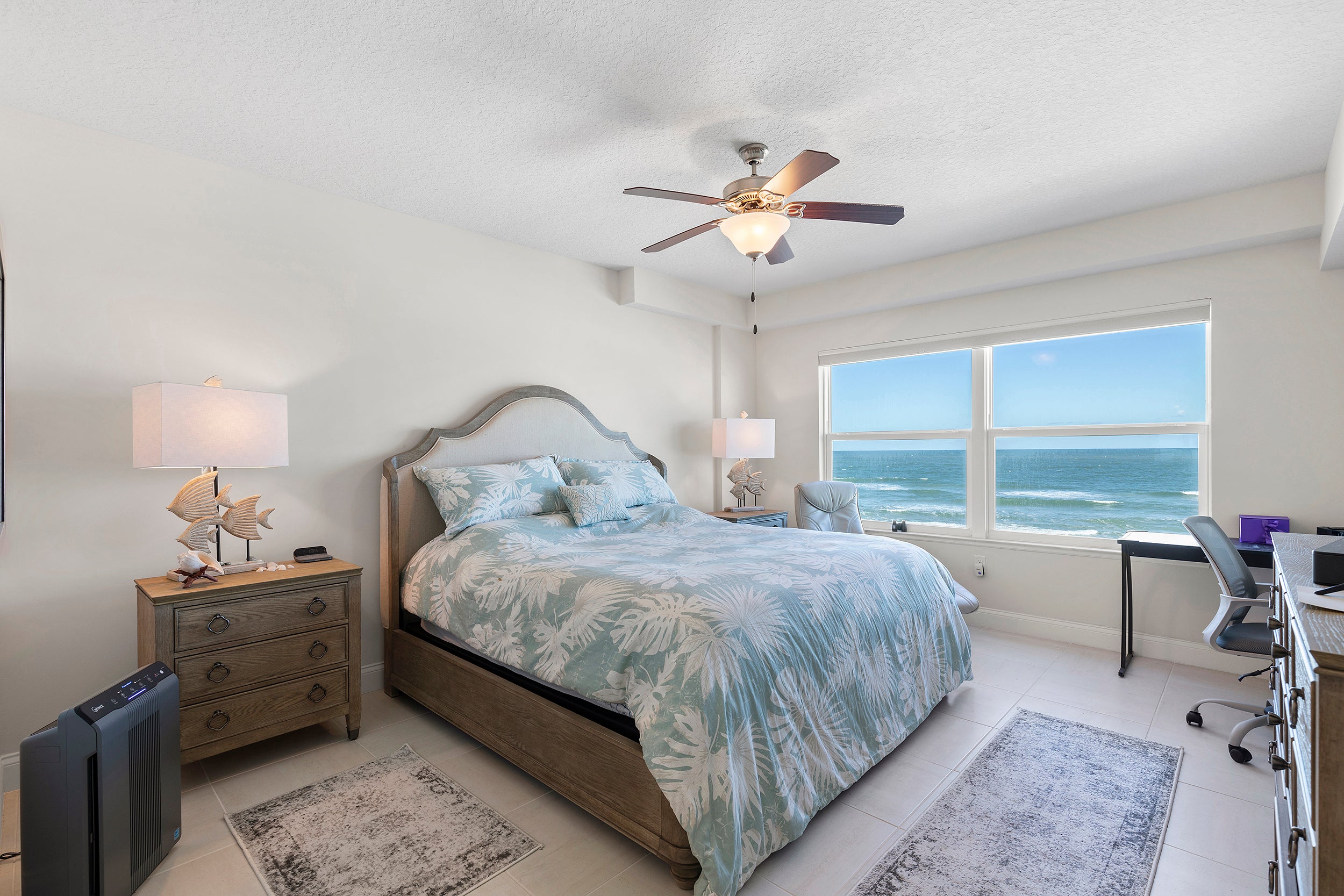 Large primary bedroom with stunning ocean views